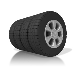 A set of four automotive tires with chrome rims.