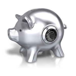 An image of a metal piggy bank that looks like a safe.