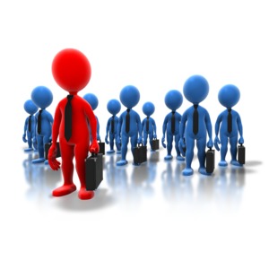 An image of a stick figure standing out leading the group of professionals.