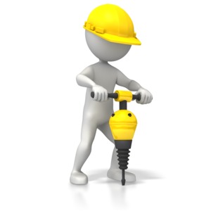 A construction worker using a jackhammer or construction drill.