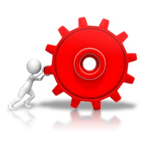 An image of a stick figure pushing a large gear.