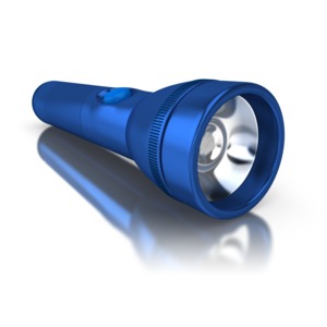 An image of a flashlight on the ground.