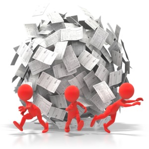 A huge ball of papers and document forms is in danger of rolling over three office workers in this concept of being overloaded with paperwork or bureaucracy.