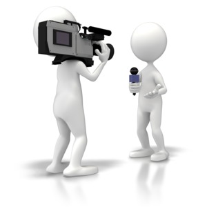 A news crew cameraman and reporter broadcast a news story.  A concept for breaking news or broadcasting.