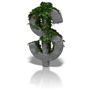 A stone dollar symbol sits covered in a growth of ivy.