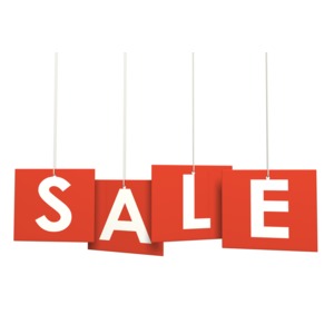 An image of four individual boards of hanging letters that spell out a sale sign.