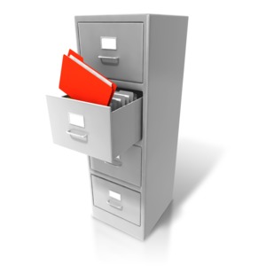 An image of a file being extracted from a filing cabinet.