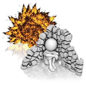 A stick figure shelters behind a ruined wall from an fiery explosion.