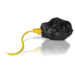A power cord plugged into a chunk of coal.