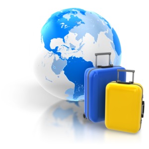 An image of two pieces of luggage in front of the world.