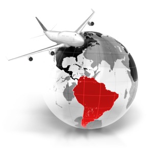An image of a commercial airline flying over the world with South America highlighted.