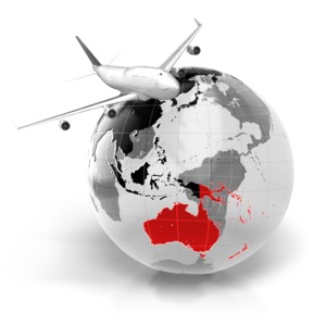 An image of a commercial airline flying over the world with the Australia highlighted.