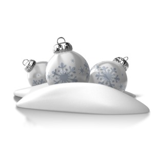 Three Christmas ornaments lie in a pile of snow in this seasonal Christmas clipart.