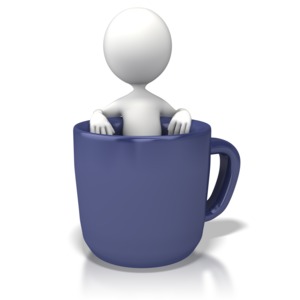 A stick figure relaxes in a large mug of coffee in this concept of a coffee break. 