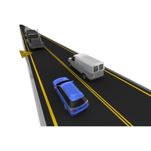 A car passes in a no passing zone as a semi is in the oncoming lane.  Right side driving.