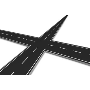 This clip art show an intersection of four two lane roads.