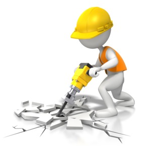 An image of a construction worker jackhammering the concrete.