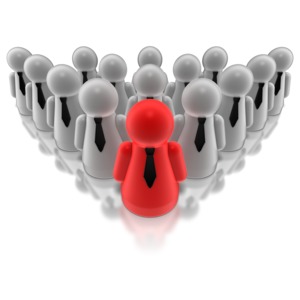 A red figure stands-out from his team. This clip-art can represent taking the lead.