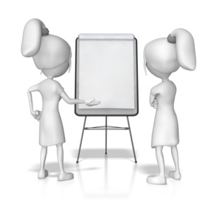 Two women discuss something on a flip board. 