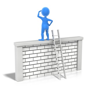 An image of a stick figure standing on top of a wall looking out.
