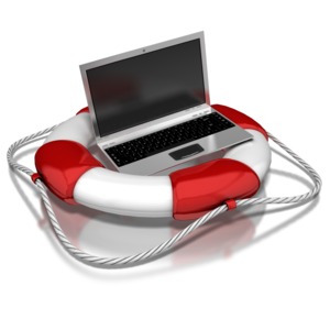 A notebook computer sits in a life-preserver.