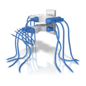 An electrical power outlet with way too many plugs plugged into it.