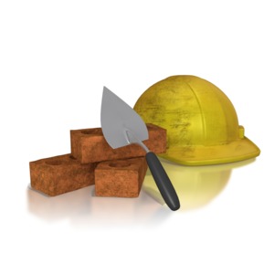 An image showing a Mason&#039;s tools a hard hat, bricks, and a trowel.