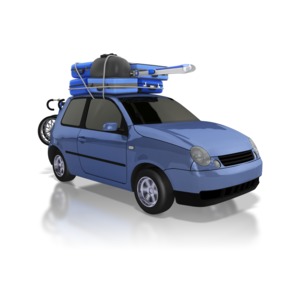 A car packed with luggage on top and bikes loaded on back takes a road trip.