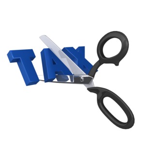 A pair of scissors is shown cutting the word tax.