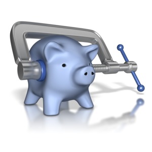 This clip art shows a piggy bank with a clamp tightening down on it.