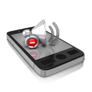 An image of a cell phone with a mute symbol on top of the glass.