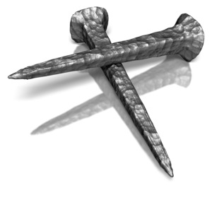 Two ancient iron nails forming a cross symbol.