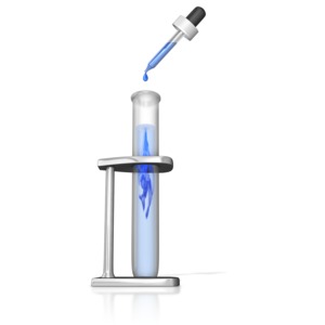 An eye dropper drops a solution into a test tube making a cloud of solution.