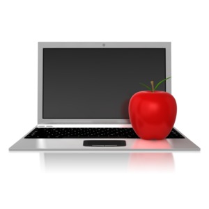 An apple sitting on top of a laptop.