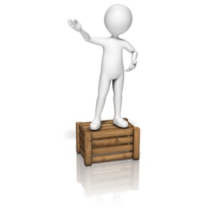 A stick figure stands on a crate and gestures as it communicates to an unseen crowd.