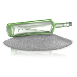 A beached sealed bottle with a message note in it.