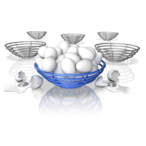 This clip art shows a basket full off eggs with a couple spilling over and breaking.  This displays an idiom of putting all your eggs in one basket.
