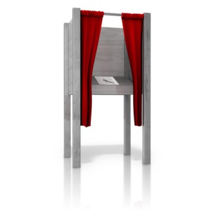 An open voting booth with ballot ready to fill out.