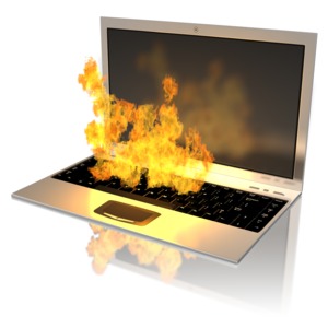 A notebook computer on fire. This clip-art can represent a computer over-heating.