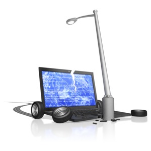 A laptop computer crashes into a light pole.