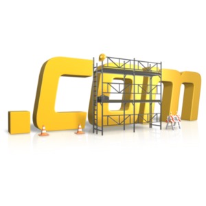 An image of a dot COM word surrounded by scaffolding under construction.