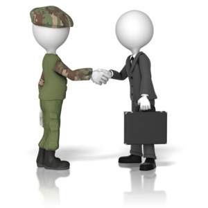 One military figure shakes the hand of a business figure holding a briefcase.