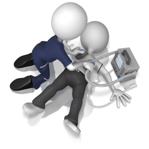 An EMT stick figure uses a defibrillator to revive another stick figure laying on the ground.