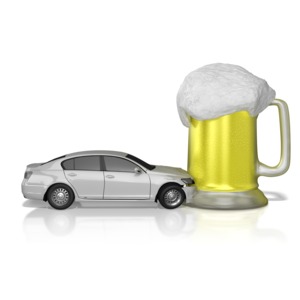 A car crashes into a big mug of beer.  Displays a concept of drinking and driving causes accidents.