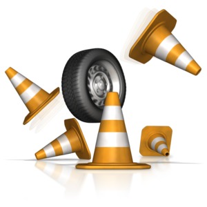 An out of control tire crashes through safety cones.