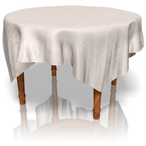 A wooden table with a tablecloth covering it.