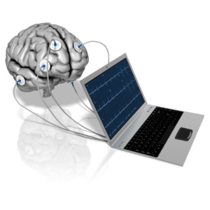 A notebook computer is connected to a brain via electrodes.
