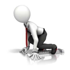 An image of a business stick figure at the starting block of a race.