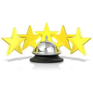 five stars stand behind a hospitality service bell.