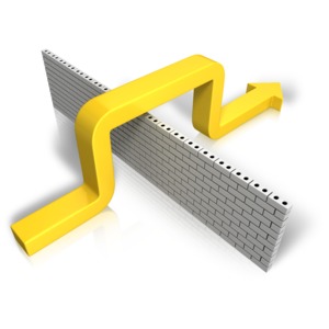 An image of an arrow going over top of a wall.